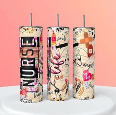 three cylindrical candles with different designs on them