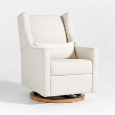 a white reclining chair on a wooden base