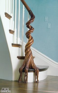 a spiral staircase in a house with blue walls