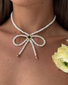 Adorn yourself with elegance and charm with our Pearl Bow Choker Necklace. This stunning piece from our Elegan Coquette Jewelry collection features lustrous freshwater pearls delicately strung together to create a timeless and sophisticated design. Perfect as a romantic birthday gift for your girlfriend, sister, or friend, this necklace exudes femininity and grace. Elevate any outfit with a touch of classic beauty and make a lasting impression with this exquisite piece.  Handmade item  Location: Elegant Beaded Necklaces For Mother's Day, Elegant Pearl Necklace For Birthdays, Elegant Green Pearl Necklace For Gift, Handmade Elegant Pearl Necklace For Mother's Day, Elegant White Pearl Necklace For Birthday, Elegant Handmade Pearl Necklace For Mother's Day, Green Pearl Necklace For Gift, Elegant Beaded Jewelry For Birthday, Elegant Beaded Jewelry For Birthdays