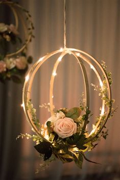 a flower arrangement hanging from a chandelier