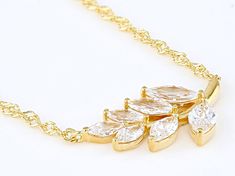 Bella Luce® white diamond simulant 2.45ctw marquise, Eterno™ 18k yellow gold over sterling silver leaf necklace. Necklace measures approximately 18.00" L x 0.03" W and has a 2" extender and lobster claw clasp closer. The necklace drop measure approximately 0.88" L x 0.50" W. The diamond equivalent weight is 1.48ctw. Sterling Silver Leaf Necklace, Diamond Simulant, Leaf Necklace, Silver Leaf, White Diamond, Sterling Silver Necklaces, Cubic Zirconia, Silver Necklace, Yellow Gold