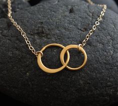 "Forever linked together, two eternal circles form the center of this beautiful necklace. The two linked circles are in vermeil and catch the light beautifully. At the center of a gold filled chain and spring clasp, these symbols of eternity and love create a necklace of elegance, and simplicity. The circles measure 12mm (1/2\") and 9mm (3/8\") in diameter, with the two circles together measuring 19mm (3/4\") across. Your item comes wonderfully boxed and wrapped so you can give it as a gift - or Double Circle Necklace, Eternity Necklace, Interlocking Circle Necklace, Silver Bridesmaid, Circle Jewelry, Gold Circle Necklace, Ankle Jewelry, Sister Necklace, Friendship Jewelry