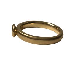 Spun Satin ring is a brushed finished 3.5mm band crafted in 14K yellow gold. Its simple, classic design will make a beautiful engagement ring. The band is a comfort fit, 3mm band that features a brushed finish. The bezel holds a .25ct H/SI1 diamond This ring can be worn all on its own or worn in a stack as pictured. Every Antique piece of jewelry we sell at Heirloom Pavé has been checked for safety of each prong and repaired as needed.***With any pre-owned/Vintage/Antique items, it is common to Yellow Gold Promise Ring With Smooth Bezel, Formal Recycled Gold Stackable Rings With Round Band, Formal Stackable Rings In Recycled Gold, Formal Stackable Rings With Round Band In Recycled Gold, Formal Stackable Round Band Rings In Recycled Gold, Yellow Gold Rings With Tension Setting Thick Band, Hand Forged Round Band Promise Ring, Hand Forged Round Band Rings For Promise, Hand Forged Minimalist Anniversary Rings