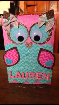 a card with an owl on it and the word lauren written in pink, blue and brown