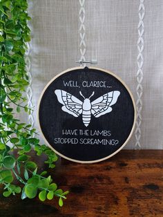 a black and white wall hanging with the words, will claric have the lamps stopped screaming?