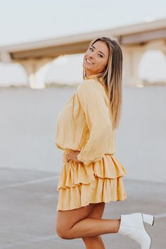 3/4 sleeve, mock neck dress with smocked waist line and tiered skirt. Stephanie is wearing a size smallLinedSize Chart:Small: Waist: 26 in. Bust: 34 in.Medium: Waist: 28 in. Bust: 36 in. Large: Waist: 30 in. Bust: 38 in. HEY BABE! WE ONLY OFFER STORE CREDIT FOR RETURNS! Feel free to email us or DM us on Instagram with any questions regarding fit or sizing or our return policy in general. Fall Tiered Skirt Dress With Smocked Cuffs, Fall Tiered Dress With Ruffle Hem, Fall Tiered Ruffle Dress, Chic Dresses With Smocked Cuffs And Tiered Skirt, Chic Tiered Skirt Dress With Smocked Cuffs, Chic Long Sleeve Tiered Dress For Daywear, Chic Long Sleeve Tiered Daywear Dress, Fall Tiered Dress For Brunch, Fall Ruffle Dress With 3/4 Sleeves