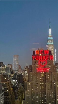 the new york city skyline is lit up in red and blue at night with skyscrapers