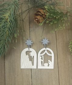 the nativity scene earrings are made out of white plastic