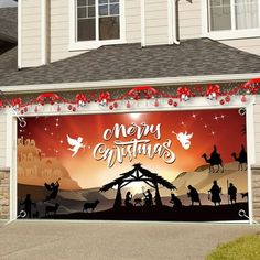 a garage decorated for christmas with the nativity scene painted on it