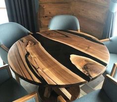 a wooden table with chairs around it