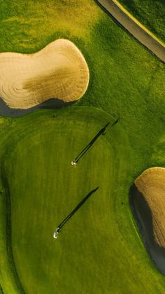 an aerial view of a green golf course