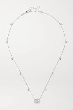 Gucci's delicate necklace is an easy and subtle way to incorporate the house's iconic 'GG' motif into everyday outfits. Cast from 18-karat white gold, it's set with 0.22-carats of shimmering diamonds and has an adjustable chain. Show yours of with plunging necklines. Gucci White Gold Jewelry With Diamond Accents, Gucci Diamond Jewelry With Diamond Accents, Modern Gucci Sterling Silver Jewelry, Gucci Jewelry With Diamond Accents For Gift, Gucci Classic Jewelry For Everyday Luxury, Gucci Classic Everyday Luxury Jewelry, Gucci Fine Jewelry With Diamond Accents, Gucci Silver Sterling Silver Necklace, Classic Gucci White Gold Necklace