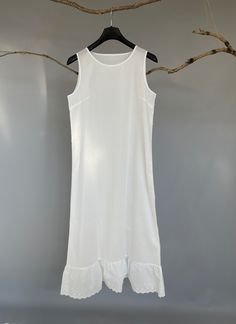 "100% Premium quality cotton slip, cling free, soft, comfortable and no itch. An exquisite accessory for your wardrobe, this soft and light slip can be worn to layer under any sheer caftans, tunics, dresses (as shown in the picture), traveling, and just as a lovely night dress at home. -100% cotton -Ankle length -Eyelet hem -Slightly A-line shaped -The last two pictures are for reference of the slip's length underneath a maxi dress. Please provide your full bust measurement ( measured around the Fitted Cotton Slip Dress For Summer, Casual Slip Dress For Spring Daywear, Casual Spring Daywear Slip Dress, Summer Plain Cotton Dress, Summer Stretch Slip Dress For Sleep, Casual Summer Slip Dress For Loungewear, White Slip Dress For Spring Daywear, Casual White Slip Dress For Spring, Spring Stretch Slip Dress For Loungewear