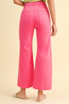 Pink denim wide leg pants with tummy control and raw seam hem Feel trendy and stylish in these Chasing Sunsets Pink Denim Pants! Featuring a button and zipper front closure, five pocket style, tummy control, and wide legs with unfinished raw hem. It's comfy, modern fashion meets vintage inspiration! Super cute and fun! Dress them up with heels and a bodysuit, or wear casually with sneakers and a tee. Stretch level: no stretch, some stretch, very stretchy True to size fit; slightly cropped Model is wearing a small Button and zipper front closure Belt loops Tummy Control 5 pocket style Wide legs with unfinished raw hem Unlined, non-sheer, lightweight denim Small - rise: 11" and inseam: 27 1/2" 85.8% Cotton, 11.2% Polyester, 3% Spandex Gentle wash cold | Line dry Trendy Pink Wide-leg Jeans, High-waist Pink Denim Bottoms, Pink Solid Color Wide-leg Pants, Pink Wide-leg Bottoms With Cargo Pockets, Pink Wide-leg Bottoms With Button Closure, Colored Pants, Wide Leg Denim, Modern Fashion, Denim Pants