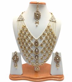 "Handmade Indian Jewelry Rani Haar Necklace Set With Pearl imitation , Czech , Gold Plated indian Jewellery Bollywood jewelry  *Type :Rani Haar Necklace Set *Necklace Length: 14\"inches Approx + Adjustable Necklace Thread. *Earrings Length: 3.5\"inches Approx *Shape - As Shown in Picture It is a perfect match with formal attire on special occasions or with casual wearing The item will come with the clear plastic box or plastic bag and packaging Traditional Indian Wedding Jewellery Slight Colour variations possible due to difference in screen and photograph Care instructions Keep Jewellery away from direct heat, water, perfumes, deodorants and other strong chemicals as they may react with the metal or plating. The plating composition of Jewellery is as such that perspiration (sweat) will no Rani Har, Necklace Thread, Rani Haar, Fine Gold Jewelry, Gold Jewelry Sets, Bollywood Jewelry, Thread Earrings, Jewelry Post, Gold Jewelry Earrings