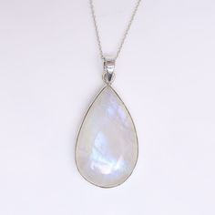 Rainbow Moonstone Pendant, 925 Sterling Silver Pendant, Gemstone Pendant, June Birthstone, Pendant Necklace, Statement Jewelry, Gift for Her Gemstone Name- Rainbow Moonstone Stone quality - AAA Pendant size - Height - 6.3 cm, Width - 2.5 cm  Pendant weight - 16.45 grams Stone Shape - As shown in the picture The Height of the pendant including the loop is 6.3 cm  18 inch Chain - The total length of the chain is 18 inch including a 2-inch adjustable chain. So you can adjust the chain from 16 inches to 18 inches. You adjust the chain by placing the lock on the adjustable chain as per your requirement. The motive of adding a 2 inch adjustable is to give our buyers an option to flaunt with different pendants in different ways. Chain Weight - 3 grams  The Pendant and the chain are stamped 925 wh White Birthstone Gemstones In Sterling Silver, White Sterling Silver Birthstone Gemstones, Rainbow Moonstone Pendant, Moonstone Stone, Birthstone Pendant, June Birthstone, Necklace Statement, Moonstone Pendant, June Birth Stone