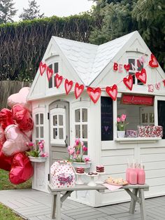 a doll house with pink and red decorations