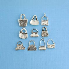 six different sized purse charms on a blue background