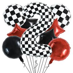 black and white balloons with checkerboard number 3 in the middle are arranged on top of each other