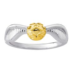 a gold and silver ring with a lion head on it's center, sitting in front of a white background