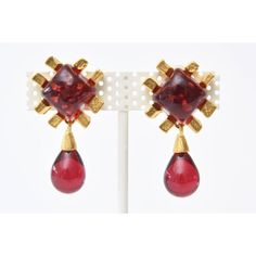 This is part of Chairish’s Costume Jewelry assortment.  This pair of stunning vintage clip on earrings are by the jewelry artist Andrew Springarn. It is done in the manner of the house of Gripoix. They are poured red glass, modernist in form and sculptural in design. The earrings are one of a kind and they are gold plated. He is no longer working in jewelry. His work was sold in Bergdorf Goodman at one time. They are more red in person rather than the burgundy color on the photos. Sorry the phot Formal Clip-on Chandelier Drop Earrings, Formal Dangle Chandelier Earrings Clip-on, Vintage Clip-on Chandelier Earrings For Formal Occasions, Formal Costume Jewelry Clip-on Drop Earrings, Vintage Clip On Earrings, Jewelry Artist, Vintage Clip, Accessories Jewelry Earrings, Best Wear