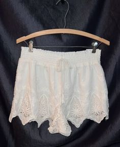 Beach White Shorts With Lace Trim, White Beach Shorts With Lace Trim, White Lace Trim Beach Shorts, White Lace Trim Bottoms For Summer, White Lace Trim Beach Bottoms, White Summer Bottoms With Lace Trim, White Lace Trim Summer Bottoms, White Lace Trim Bottoms For Day Out, White Lace Trim Bottoms For Vacation