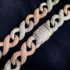 Who says only celebrities and the super-rich can afford to look fabulous? Now, you too can enjoy the luxury of a high-end fashion chain necklace without breaking the bank. Introducing our 16MM Colorful Infinity Style Miami Cuban Chain Necklace, available in a variety of lengths to suit your individual style.This stunning gold plated chain necklace is adorned with cubic zirconia stones that add just the right amount of sparkle and bling. Whether you're dressing up for a special occasion or simply wanna add a touch of luxury to your everyday look, this necklace is sure to turn heads.So don't wait any longer, order your 16MM Colorful Infinity Style Miami Cuban Chain Necklace now and start to feel like a celebrity! PRODUCT DETAILS: Necklace Type: Chains Necklaces Material: Cubic Zirconia Metal Luxury Chain Necklace For Party, Party Cuban Link Necklace, Party Necklaces With Cuban Link Chain, Luxury Link Chain Necklace For Party, Luxury Party Link Chain Necklace, White Cuban Link Party Jewelry, Luxury Pink Chain Necklace, Luxury Link Necklaces For Parties, Elegant Bling Chain Link Necklace