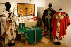 the altars are decorated with colorful cloths and cross decorations on display in this room