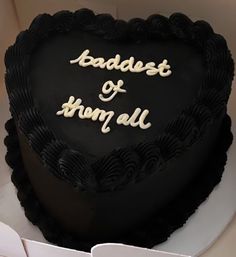 a black heart shaped cake with the words badist and thorn all on it's side