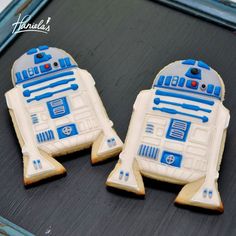 two decorated cookies in the shape of r2d2