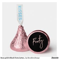 a pink foiled herss candy with the word fifty on it