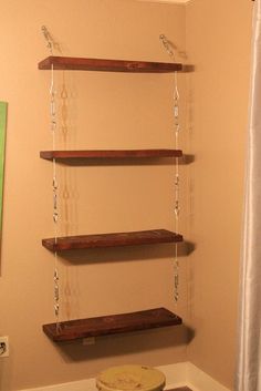 a bathroom with some shelves on the wall