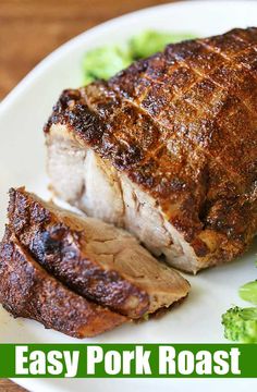 a piece of meat on a plate with broccoli and the words easy pork roast