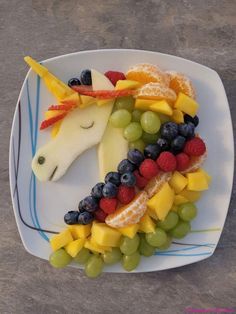 a horse made out of fruit on a plate