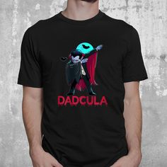 Buy Dadcula Momster Matching Halloween Costume Shirt at Fantasywears. Hight quality products with perfect design is available in a spectrum of colors and sizes, and many different types of shirts! Unisex T-Shirt – 100% Cotton (fiber content may vary for different colors) – Medium fabric (5.3 oz/yd² (180 g/m²)) – Classic fit – Tear away the label – Runs true to size Women T-Shirt – 100% combed ringspun cotton (fiber content may vary for different colors) – Light fabric (4.3 oz/yd² (146 g/m²)) – Slim fit with a longer body length – Tear away the label – Runs smaller than [...] Black Fandom T-shirt For Halloween, Novelty Black T-shirt With Character Print, Funny Black T-shirt With Character Print, Black Pop Culture Shirt For Fan Conventions, Funny Black Shirt With Screen Print, Black Pre-shrunk Shirt For Fan Conventions, Funny Black Short Sleeve Shirt, Pop Culture Top For Halloween Cosplay, Unisex Halloween T-shirt With Screen Print