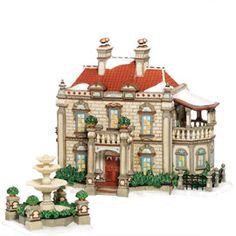 a toy model of a house and fountain