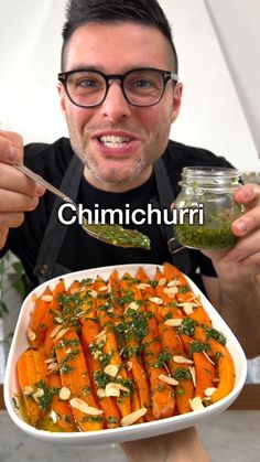 a man is holding a plate with carrots and pesto on it, while the caption reads chimicchuri