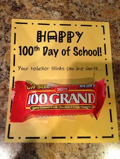 a candy bar with the words happy 100th day of school written on it in front of a sign