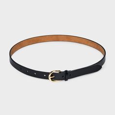 Accessorize your waist in style with this Skinny Belt from A New Day™. This solid black belt with a skinny profile features a gold metal buckle closure for sleek style and shine. The adjustable strap with multiple holes give a secure fit to all your outfits, and you can pair it with casual or dressy ensembles for versatile styling. A New Day™: Style that goes wherever you do. Trendy Belt With Gold Buckle For Work, Classic Belts With Gold Buckle For Work, Trendy Fitted Belts For Work, Trendy Formal Belt With Gold Buckle, Classic Belt With Gold Buckle And Adjustable Fit, Black Belt For Workwear, Fitted Black Belt For Workwear, Sleek Black Belt For Workwear, Sleek Black Belts For Work