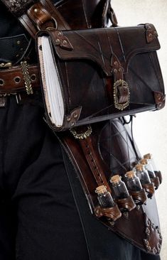 Fantasy Tool Belt, Dnd Bag Art, Multiple Belts Outfit, Goblin Accessories, Steampunk Fashion Men, Alchemist Outfit, Medieval Alchemist, Steampunk Mens Fashion, Alchemist Book