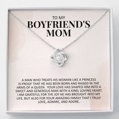 a necklace with the words to my boyfriend's mom on it in a box