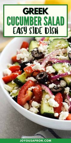 greek cucumber salad with feta cheese and olives in a white bowl