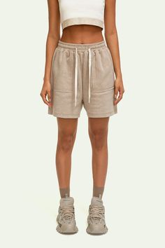 YPL's Drawstring Knitted Shorts are an essential for any wardrobe. Crafted from soft fleece, each pair features an elastic waist with drawstring, high rise, and hits at the thigh. Large pockets provide easy access and freedom of movement. Get comfortable in style! Casual Loungewear Shorts With Soft Texture, Cozy Leisure Shorts With Elastic Waistband, Comfortable Beige Leisure Bottoms, Cozy Drawstring Shorts, Comfy Drawstring Bottoms Short Length, Beige Drawstring Bottoms For Loungewear, Beige Drawstring Sweatpants For Loungewear, Casual Soft Texture Shorts For Lounging, Cozy Leisure Bottoms In Short Style