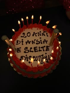 a birthday cake with candles on it that reads 20 anni diansia e selette dictity