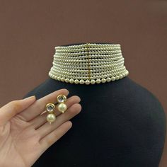 Kundan choker necklace with matching earrings Perfect for any kind of occasions and ceremonies. You can wear it with Saree lehenga and Evening Gowns. Highest quality and craftsmanship. Arrives in box Please let me know if you have any questions White Temple Jewelry Choker For Reception, Elegant Choker Set For Diwali, Elegant Heavy White Lehenga, White Choker For Parties And Festivals, White Festive Choker For Formal Occasions, Festive White Choker For Formal Occasions, White Festive Formal Choker, Bollywood Style Round Wedding Choker, White Choker Bridal Necklace For Reception