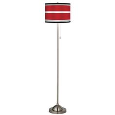 a floor lamp with a red and white striped shade on the bottom, and a silver base