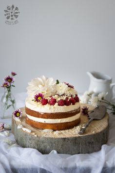 a cake sitting on top of a wooden cutting board