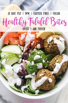 healthy falafe bites in a bowl with greek salad and dressing on the side