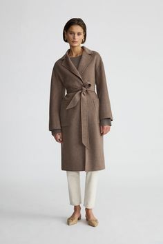 A classic timeless design made of cashmere blended with wool for warmth and durability. This coat can be worn tied up or open from day to night.  Features- Chocolate Melange colour- Created in Inner Mongolia Materials & Care- 10% cashmere wool blended with 90% merino wool- Steam clean only Size & Fit- Model is Elegant Brown Sweater Coat For Fall, Chic Brown Long Sweater Coat, Elegant Brown Long Pea Coat, Taupe Wool Outerwear For Fall, Brown Wool Long Sweater Coat, Chic Brown Long Wool Coat, Chic Brown Wool Pea Coat, Chic Brown Wool Sweater Coat, Classic Brown Long Sweater Coat